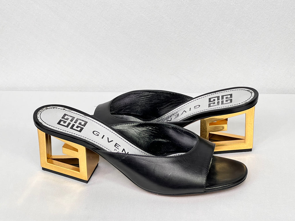 Pre-owned black leather Givenchy mule sandals with gold-tone geometric block heel, side view