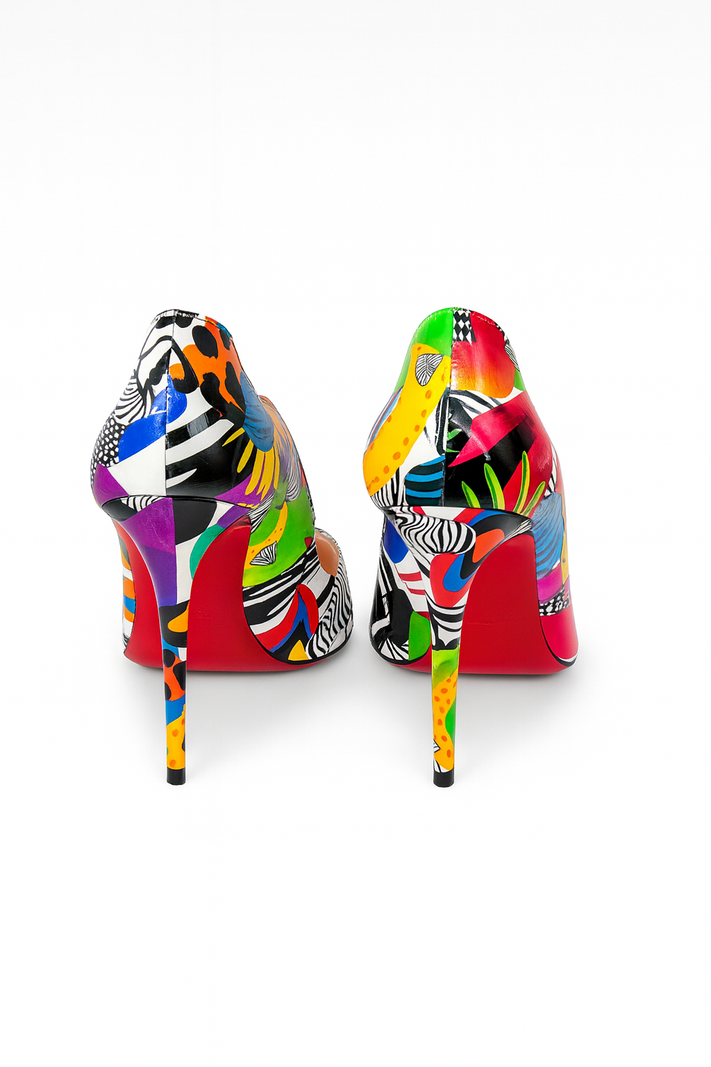 Back view of Christian Louboutin Hot Chick 100 stiletto heels showing sculptural silhouette.