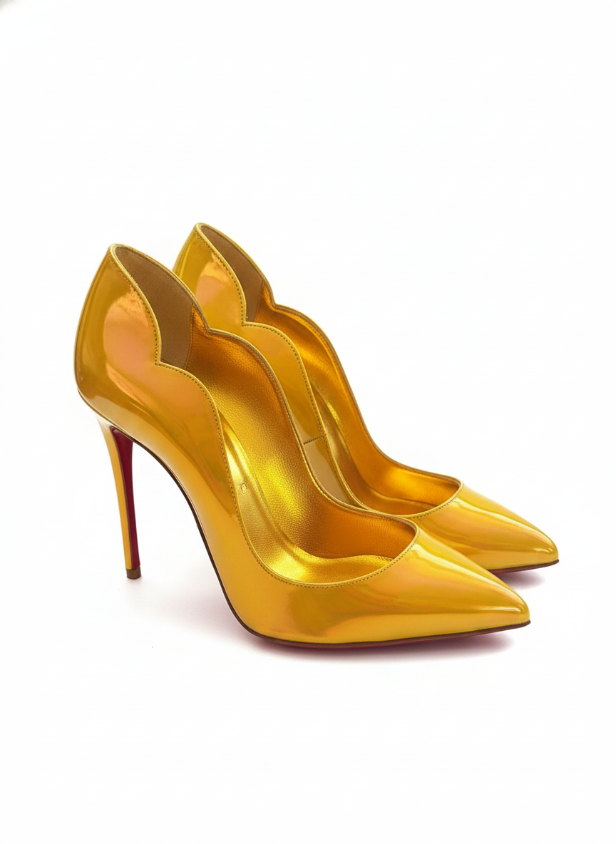 Detailed side view of Christian Louboutin Hot Chick 100 patent leather pumps in metallic yellow.