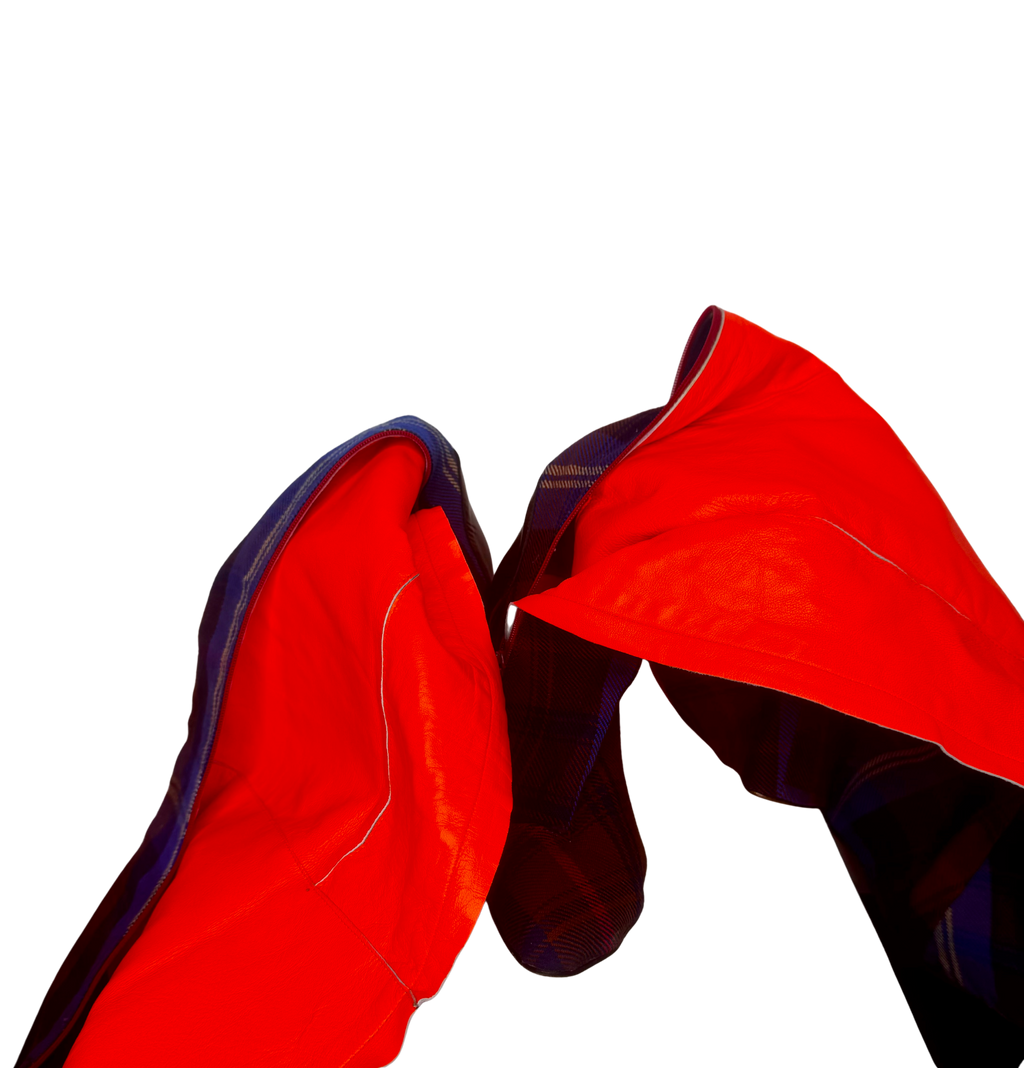 Interior view of Vivienne Westwood over-the-knee boots showing red leather lining and structured interior finish.