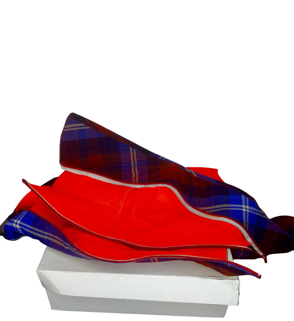 Top-down view of Vivienne Westwood tartan boots opened to reveal red leather lining and craftsmanship details.