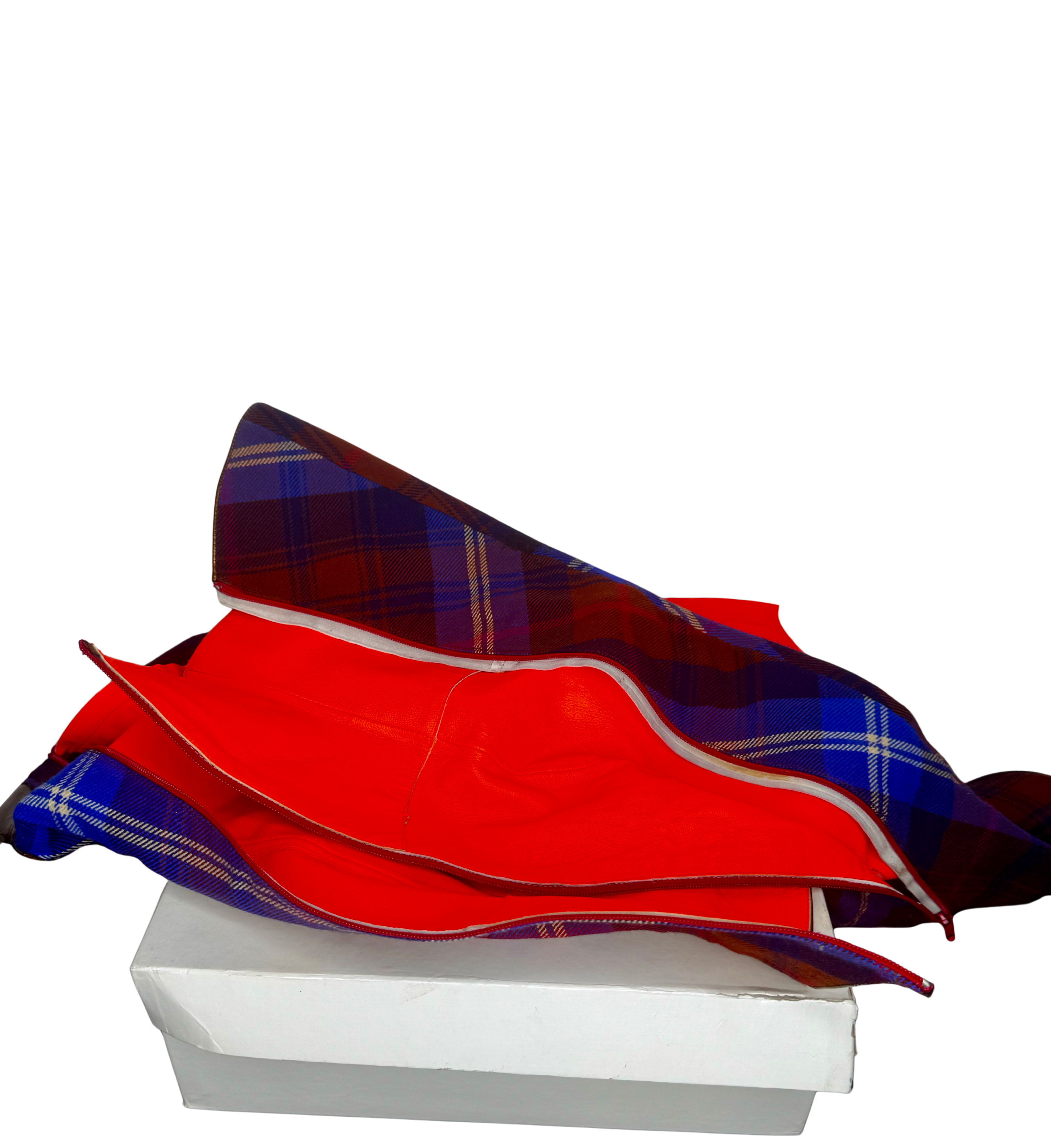 Top-down view of Vivienne Westwood tartan boots opened to reveal red leather lining and craftsmanship details.