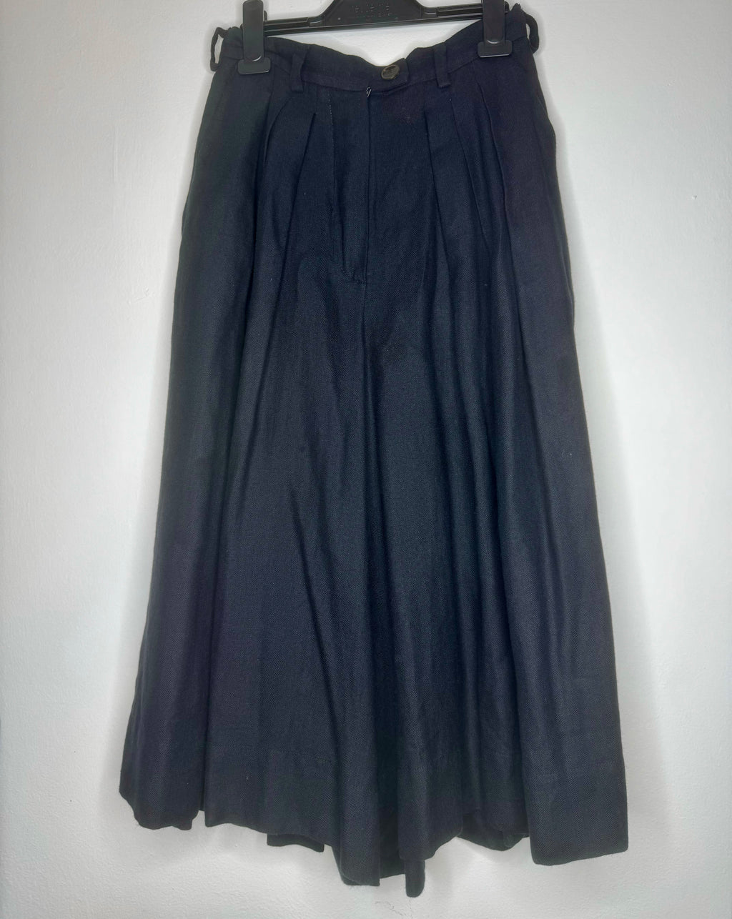 Front view of vintage Vivienne Westwood black culotte skirt featuring high waist, soft pleating and wide-leg silhouette.